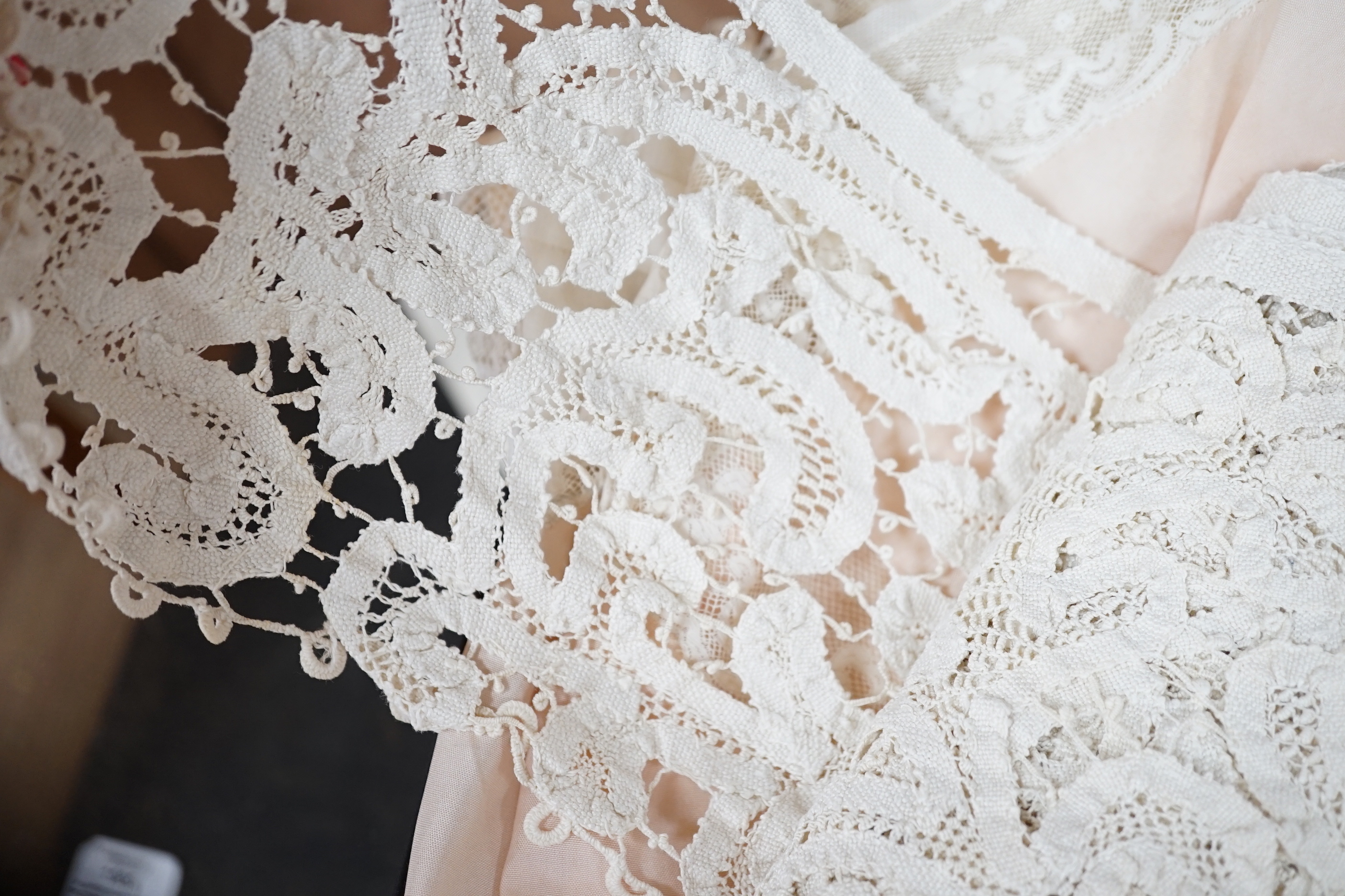 Two Edwardian pink silk and lace inserted camisole tops, a fine 1920’s blouse, a chemise and a pink silk knitted scarf, a bobbin lace collar and length of trimming